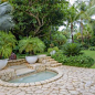 Photo of a huge tropical stone landscaping in Miami.