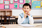 Royalty-free Image: Young boy contemplates his work in class