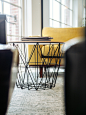 selective focus photography of coffee table beside sofa chair