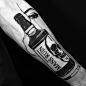 Louis Loveless tattoo smokey eyes behind bottle