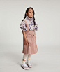 Misty Jumbo Cord Skirt : Soft and thick skirt made from plush jumbo corduroy.Front pocket pouch and braces detail. Machine wash 30 o Can tumble dry.Composition: 100% Cotton