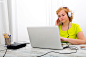 Young plus size woman listening to Audio while working on a lapt by Michael Osterrieder on 500px