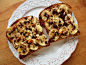 Peanut butter & banana toast (on sprouted grain bread) topped with a sprinkle of brown sugar, chopped dark chocolate chips, and chopped almonds - lightly broiled until chocolate chips melted and bananas became golden.