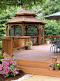 A gazebo added on to a backyard deck; from plain to enchanting! Idea by Better Homes and Gardens magazine: 