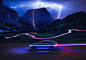 The Concept EQ in a mountain landscape. Huge lightning bolts illuminate the night sky and the surrounding rock formations. The track of the vehicle snakes its way through the serpentines.