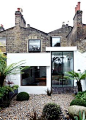 A London house with Victorian brick, a modern extension, and Velfac windows