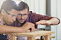 Carpentry teacher and student examining measurement by Caia Images on 500px