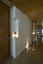 Architecture, Luxurious Day Spa Interior with Clean and Wood Accent: Corridor With White Wall And Wood Ceiling And Door