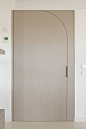 white pivot door hal