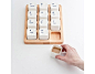 [【产品设计】小键盘现身马克杯的世界。] 来自上海E Square设计室的小键盘咖啡杯（Keyboard Coffee Cups），一个木托盘，拖上12个咖啡杯，每一个都是有 个ID的，朋友多了就不会拿错杯子了