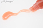 化妆用品,唇膏,影棚拍摄,液体,彩妆_122646616_Lip gloss squeezed out of tube_创意图片_Getty Images China