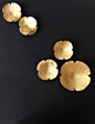 Golden Graces Wall art sculpture Opulent gold finish porcelain 5 ceramic wall decor flowers Bedroom Bathroom Living room art READY TO SHIP : These golden porcelain flower wall sculptures will appear to float on the surface of your wall, and can be arrange
