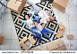 Moving concept. Happy family lying on carpet among cardboard boxes, top view