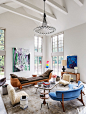 living room with artworks by Anselm Reyle, Ugo Rondinone, and Zhu Jinshi