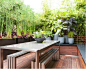 Example of a trendy backyard deck container garden design in Seattle