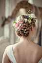 The beautiful rose garland intertwined with a braid makes for a very attractive wedding hairstyle indeed!