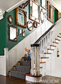 A gallery-style arrangement of mirrors, both antique and reproduction, make a pretty display along the stairwell wall. - Photo: Werner Straube / Design: Corey Damen Jenkins: 