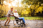 Senior couple in wheelchair in autumn nature. by Jozef Polc on 500px