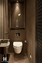 I love the luxury high end feel this textured brown wall gives this bathroom!: 