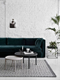 I like the textured wall, and how the green couch looks in front of it - This is the colour scheme I am going for.: 