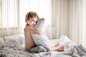 Little boy on a bed with a pillow by Mika Sanders on 500px