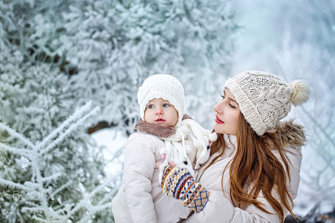 Mother holds daughte...