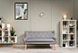 Free photo interior design with photoframes and grey couch