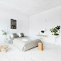 Projekt Praga transforms Polish brewery into minimal holiday apartments : Warsaw studio Projekt Praga has created a suite of pared-back and plant-filled holiday apartments inside a 20th century brewery in southeast Poland