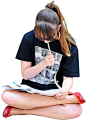 girl sitting on ground, reading and writing: 