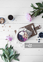 A smoothie bowl with blueberries and buckwheat flakes (seen from above)