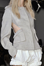 Structured grey jacket with cut out detail alongside the pockets - cutaway fashion; cool fashion design details口袋设计