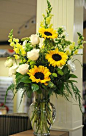 Beautiful arrangement... Sunflowers, white roses, yellow snapdragons, white garden phlox, and lime button mums.