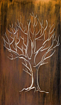 The simple beauty of a bare tree is captured in laser cut rusted metal. Attach to a garden or courtyard wall and back light to create art and ambiance in one.: 