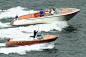 Roger Federer and Lleyton Hewitt play tennis on speedboats during the launch of Fast4 Tennis. - Getty Images