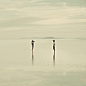 Man And Woman Standing On The Flooded Bonneville Salt Flats, Taking Photographs Of Each Other At Dus by Mint Images on 500px