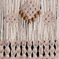 Macrame Wall Hanging : Let your bohemian side shine through with this handmade macrame hanging. This piece measures 11 inches (28 cm) wide by 24 inches (61cm) long. 
