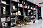 Floor-to-ceiling bookshelves line a hallway at Ralph Rucci's New York headquarters