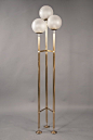 Floor Lamp  Max Ingrand (1908-1969) Fontana Arte, Italy (Milan), 1960s Three brass shafts, held with two triangular braces on round pad feet, supporting three spherical shade of satin glass at different heights. Fontana Arte model number 2229. Literature:
