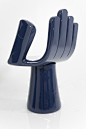 Happy Hand Chair in Navy : Hand / Palm Chair: Inspired by and attributed to the renowned artist and designer, Pedro Freideberg. Constructed using solid wood, this seat is uniquely crafted