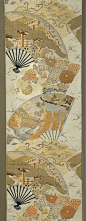 Maru obi, Japanese, 1940s. Silk and gold metallic brocading on silk. Fan motif with floral and landscape details. Peach, tangerine, pale yellow, gold, and creme on a silver-gray ground. Decorated on both sides for its full length, 12 1/2 x 150"
