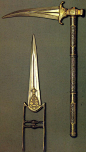 Indian weapons. Katar (push dagger), 17th century. Steel, damascened and inlaid with gold.  Zaghnal (war hammer / pick) 18th century. Steel, damascened and inlaid with gold.  The Museum of Oriental Art, Moscow.