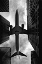 aeroplane | low flying | travel | city | black & white photography | perspective