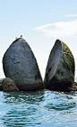 Split Apple Rock, (Kaiteriteri,  S Island, NZ)  is a geological rock formation in the Tasman Bay made of granite. The cleft to produce 2 sides of the 'apple' was a natural occurrence. It is unknown when this happened & the cleaving of the rock has att