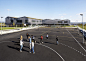 White Arkitetker adds corrugated copper walls to school in Norway : This school building in Norway was designed by White Arkitetker with copper walls and a zigzagging green roof to reference its industrial townscape.