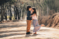 boy kissing a girl on forehead on road during daytime