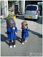 两个日本小女孩儿看日环食的照片