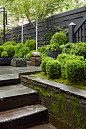 Julianne Moore’s townhouse garden on West 11th Street NYC designed by Brian Sawyer ~ Sawyer Berson  Inspired by the gardens of Ireland, this courtyard features antique bluestone sidewalk paving slabs, a fountain created from an old English sandstone troug