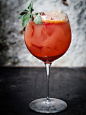 A macro view of a cocktail whiskey drink in a glass cup