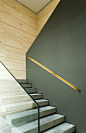 Contemporary staircase using both glass handrail and half wall with cap...: