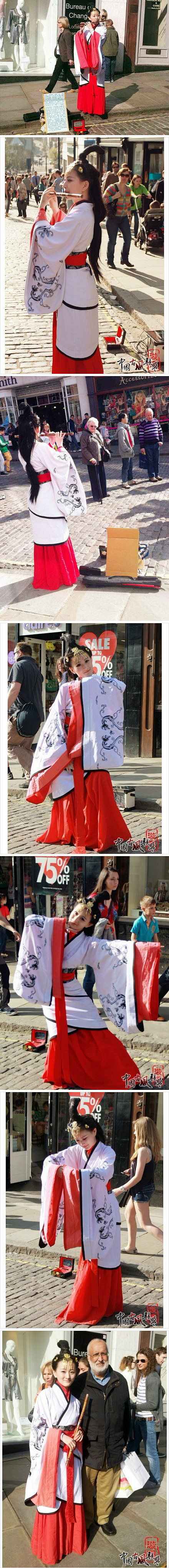一位在英国街头卖艺的身着汉服的中国女子....